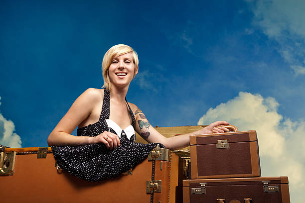 istock Retro Styled Girl with Suitcases 496820301