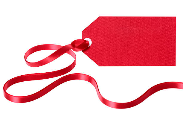 istock Red gift tag or label with ribbon isolated on white 496820340