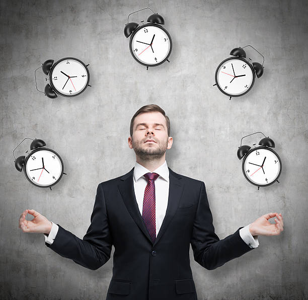 istock Meditative businessman is pondering about time management. 496821352