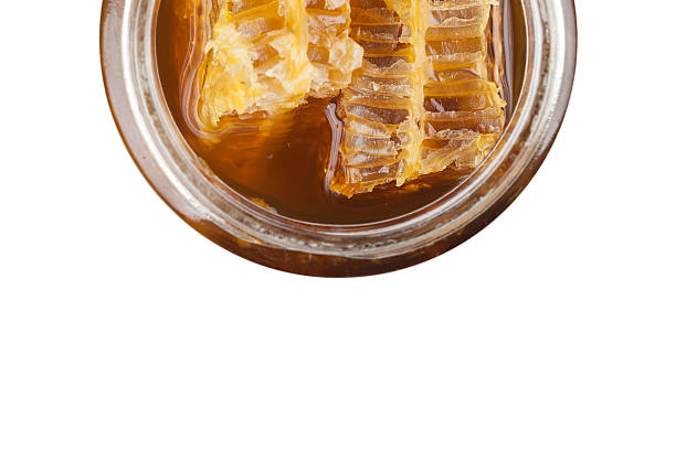 istock Honeycomb in jar of honey 496822804