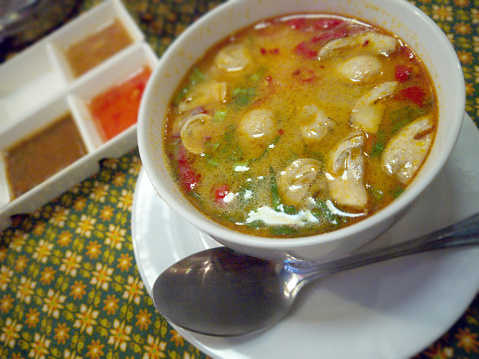 Bowl of thai Tom Yum soup in tai restaurant