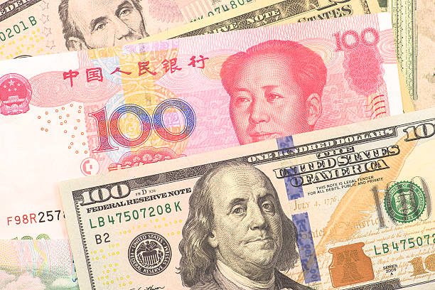 istock USA and Chinese banknotes 496824880