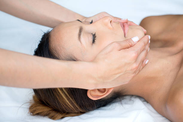 istock Woman getting a facial at the spa 496825192