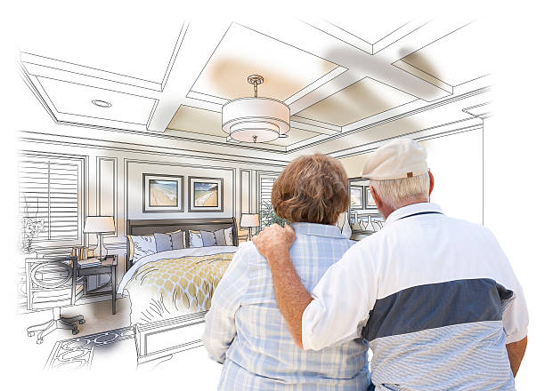 istock Senior Couple Looking Over Custom Bedroom Design Drawing Photo 496825608