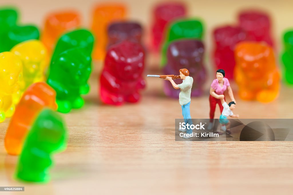 Gummy bear invasion. Junk food concept Figurine Stock Photo