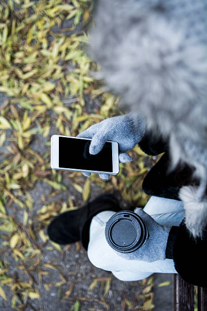 istock Girl with coffee and mobile phone 496825986