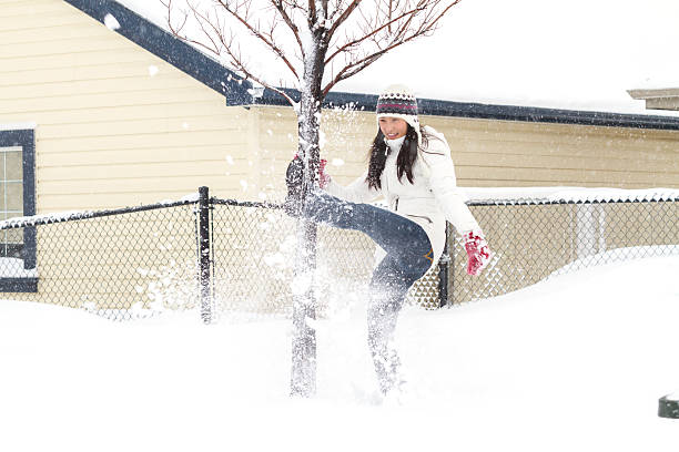 istock Young Chinese Girl Playing In Snow 496826828