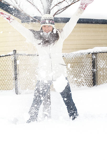 istock Young Chinese Woman Playing In Snow 496826966