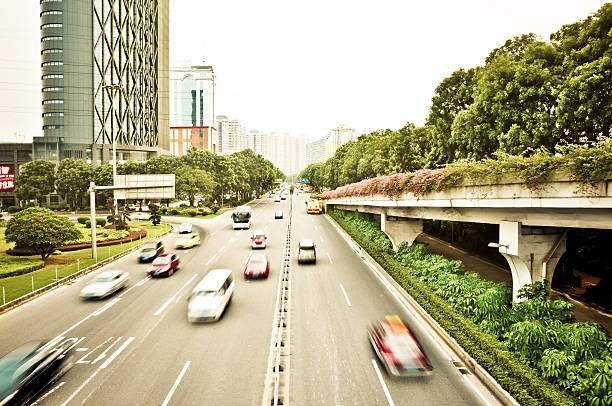 istock Fast cars drived through city center . 496826980