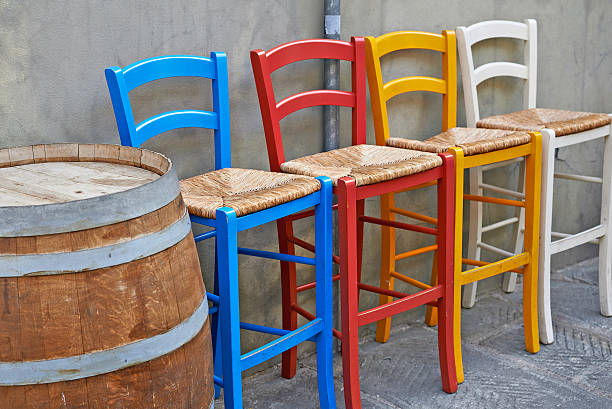 istock Colored chairs in street cafe 496826988