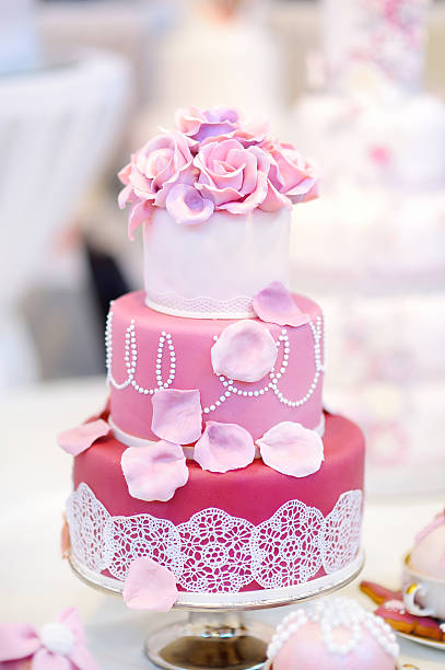 istock White wedding cake decorated with sugar flowers 496828944