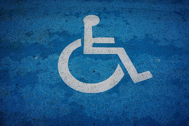 istock wheel chair sign parking spot 496829338
