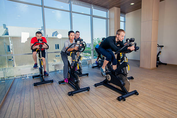 istock Group of gym people on machines, cycling In Class 496830966