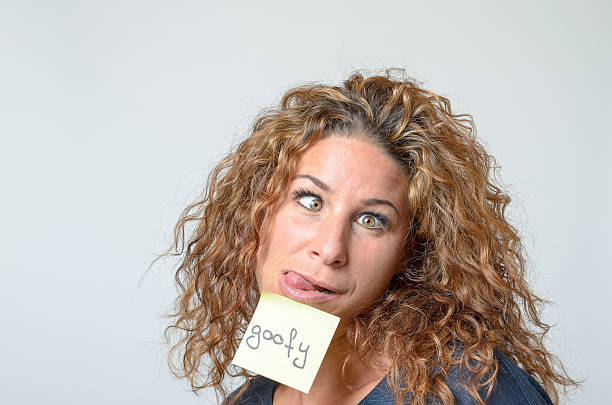 istock young woman with a sticky note in her face 496831644