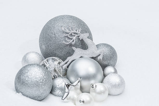 istock Snowy silver decorative Christmas ornaments with reindeer at ground level 496832828
