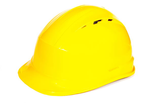 istock Closeup of yellow protective helmet on white background 496833198