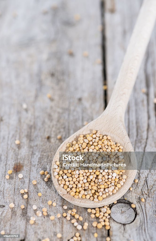 Mustard Seeds on a cooking Spoon Mustard Seeds on a cooking Spoon (close-up shot) Seed Stock Photo