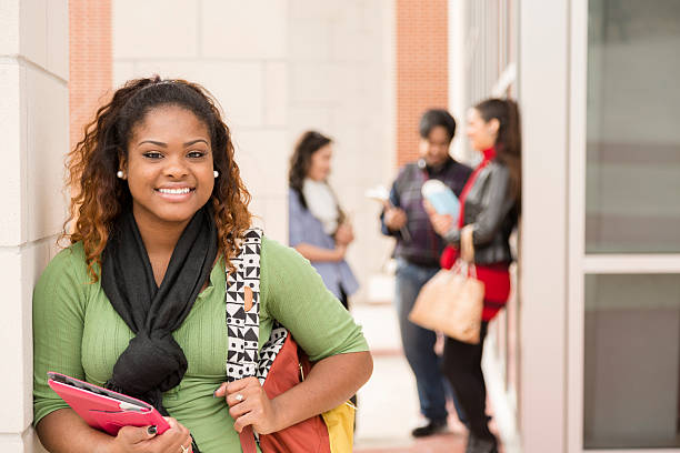 istock Education: Confident, African descent female college student on campus. 496834469