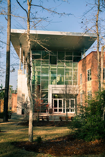 istock Architecture: Modern glass, aluminum, brick office building or college. 496834793