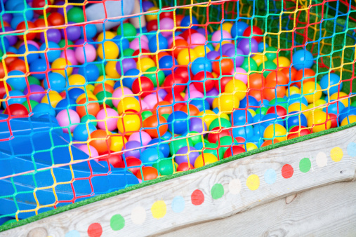 Safety net in a playground with multicoloured balls