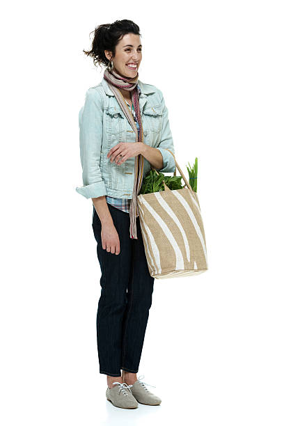 istock Smiling woman holding vegetable bag 496837857