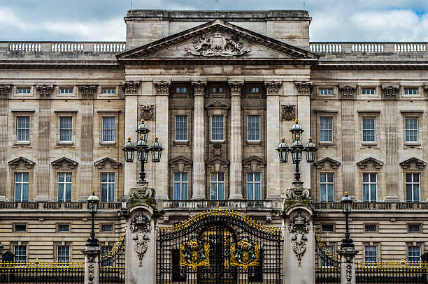 Buckingham Palace  - London, UK London, UK - March 22, 2015: Buckingham Palace. The photo was taken during an overcast day from the front of the palace at the end of The Mall. There are no people in this photo. image created 21st century blue architecture wide angle lens stock pictures, royalty-free photos & images