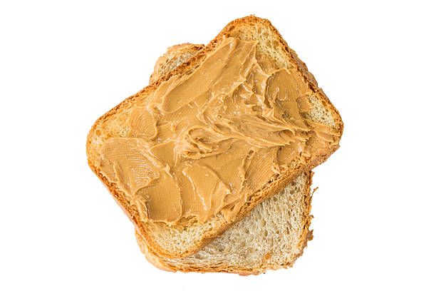 istock Peanut butter on toast isolated on white background 496851826