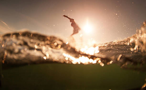 istock The girl with surf at sunrise 496852185