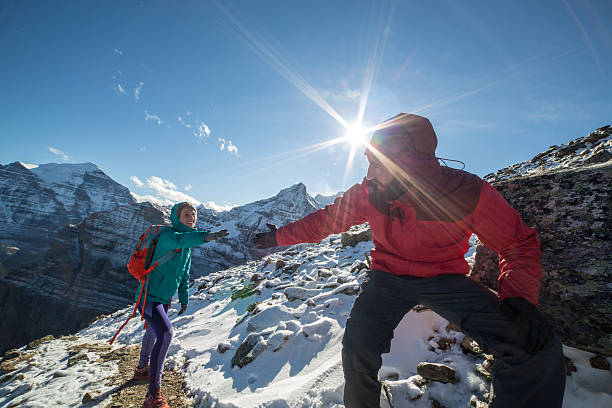 istock Hiker giving a helping hand to partner 496852564