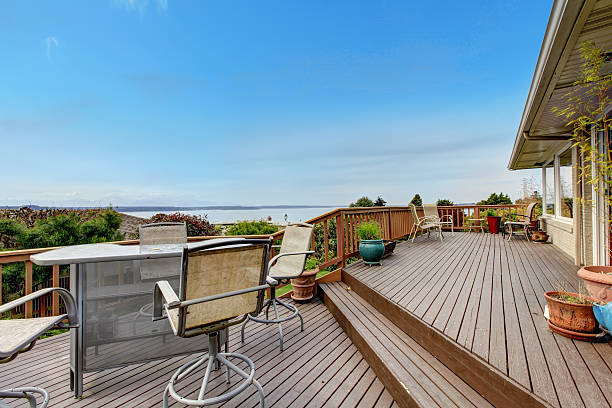 istock Walkout deck with patio area and water view 496853337