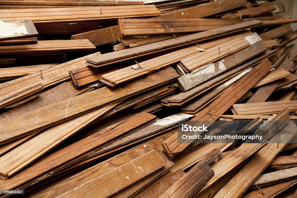 large pile of hardwood floor during construction Large pile of hardwood floor being ripped out at an apartment during construction  Apartment Stock Photo