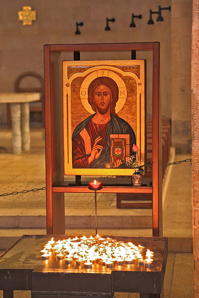istock Magnificent old icon and a burning candles 496854179