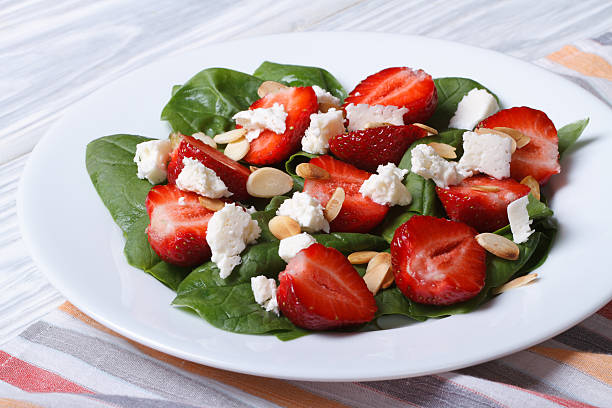 istock Salad with strawberries, spinach and goat cheese on a plate 496854533