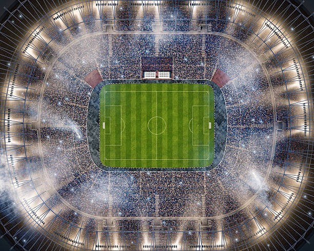 Soccer stadium upper view Bird view to the soccer stadium full of spectators and lenseflares. stadium stock pictures, royalty-free photos & images