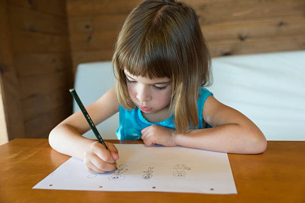 istock Little girl drawing 496854747