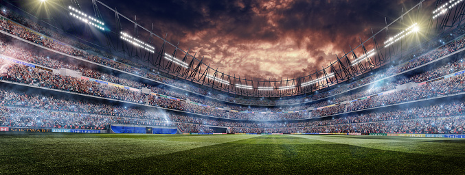 A wide angle panorama of a outdoor soccer stadium outdoor stadium or arena full of spectators under a dramatic stormy evening sky at sunset. The stadium features fake advertising and generic scoreboards. The image has depth of field with the focus on the foreground part of the pitch. With intentional lensflare. The image made in 3D.