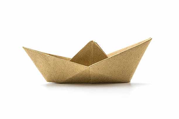 istock Paper origami brown boat . 496855619