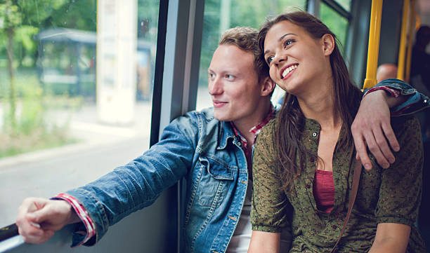 istock Embraced couple in a bus looking through the window. 496855780