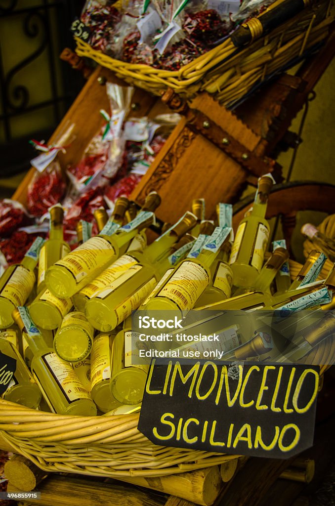 Sicilian Limoncello Taromina, Italy - July 26, 2013: Bottles of Limoncello on display outside a shop in Taormina on the eastern coast of Sicily. Alcohol - Drink Stock Photo