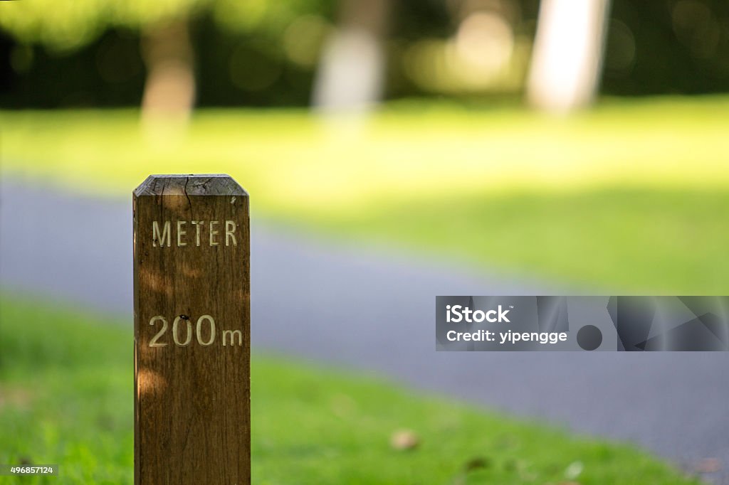 meter stake beside greenway in park Bollard Stock Photo
