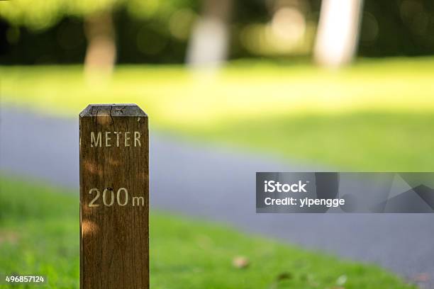 Meter Stake Beside Greenway In Park Stock Photo - Download Image Now - Bollard, Distant, 2015