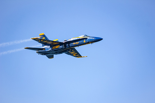 Hillsboro, Oregon, USA - May 22, 2022 : A low fly-by of an Oregon Air National Guard USAF F-15C Eagle. The Air Show in Hillsboro, Oregon is a very popular event each year. The theme for 2022 was “She Flies with her own wings.” All performers, pilots and announcers were women. Hillsboro is a suburb of the city of Portland, Oregon.