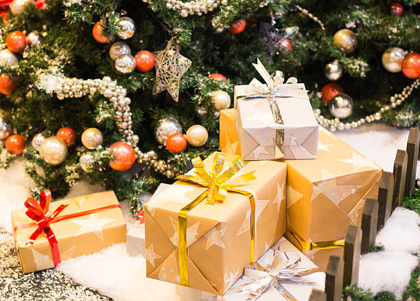 istock Stacks of Christmas presents under a Christmas tree 496858206