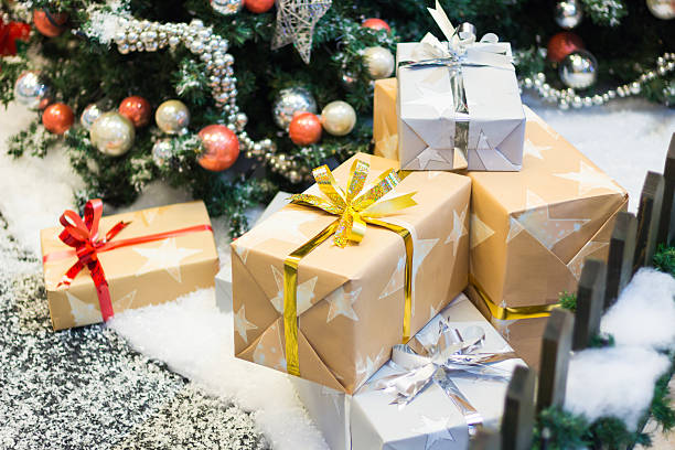 istock Stacks of Christmas presents under a Christmas tree 496858228
