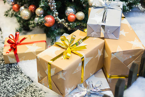 istock Stacks of Christmas presents under a Christmas tree 496858258