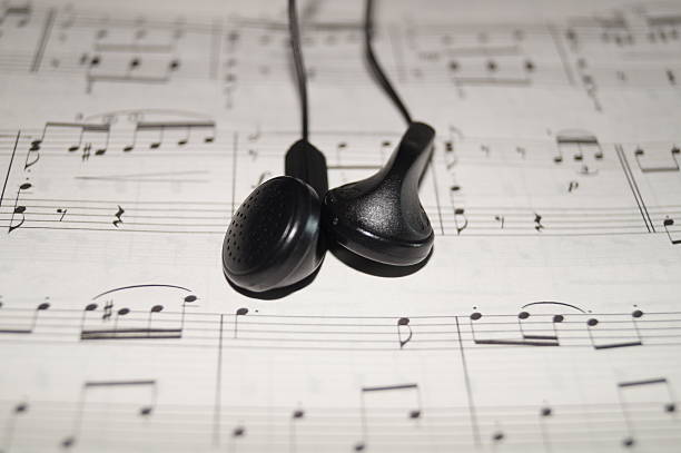 istock Earphones on sheet music. 496858375