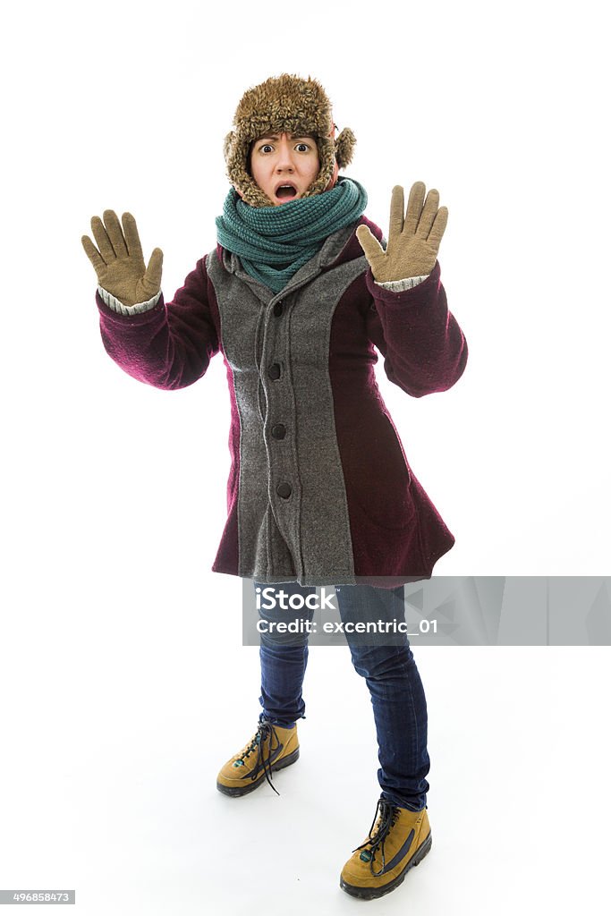 Young woman in warm clothing and making stop gesture sign Rejection Stock Photo