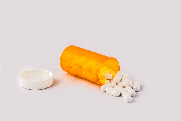 istock Pills spilling out of bottle 496858711
