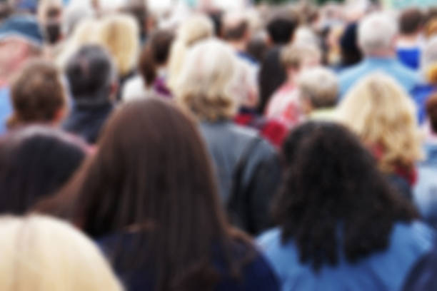 istock blurred crowd of people 496858728