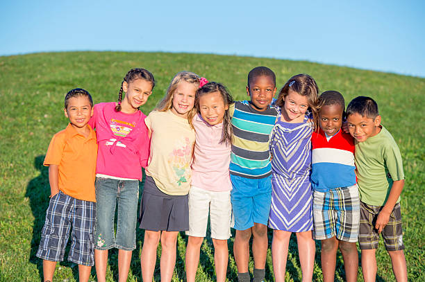 istock Children Standing in a Row Together 496858822